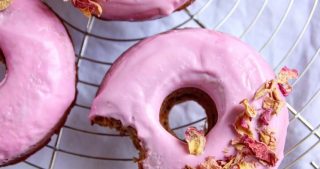 Healthy Baked Vegan Cinnamon Donuts with pink glaze