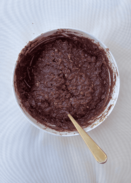 showing the mixing bowl of ingredients add the chocolate and stir