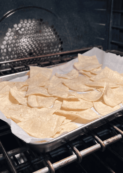 showing how to make your own tortilla chips for Vegan Chilaquiles